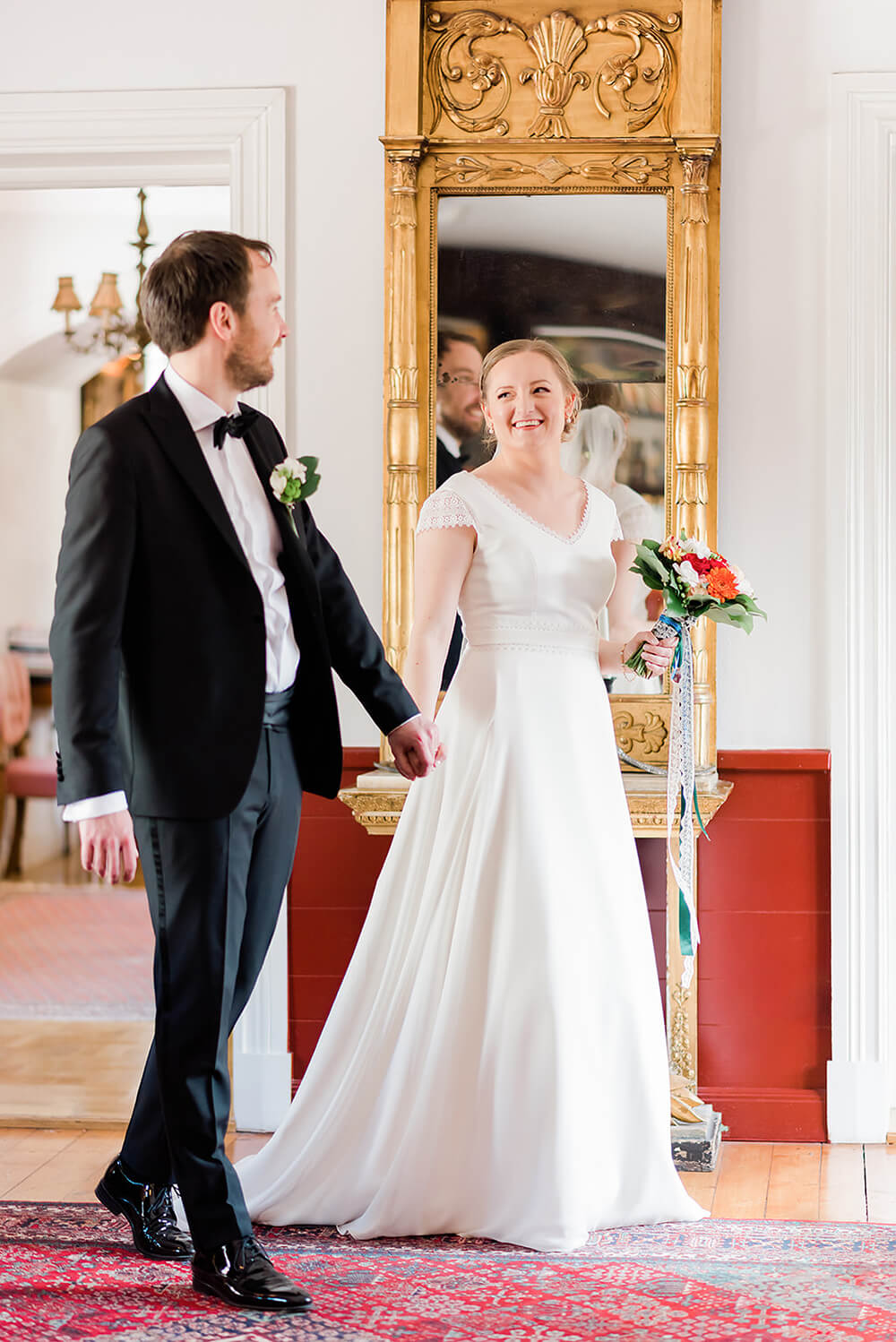 Bride and groom hand in hand after bridal toast