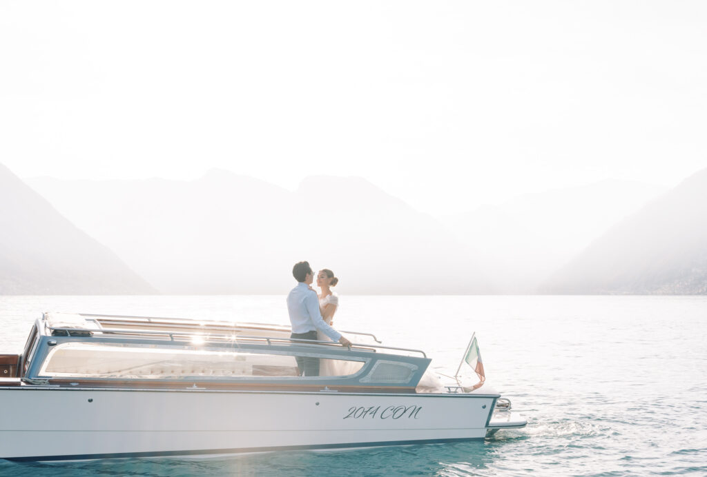 Classic wedding portrait on a wooden boat at Lake Como